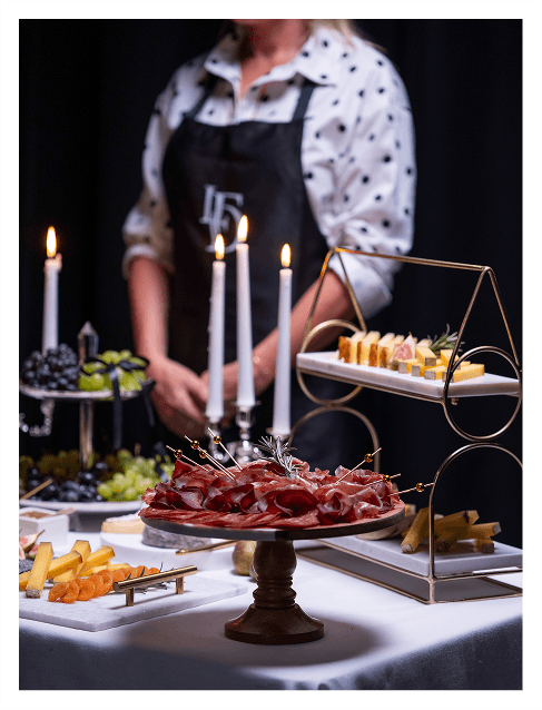 Elegant grazing table with artisan cheese and garnish